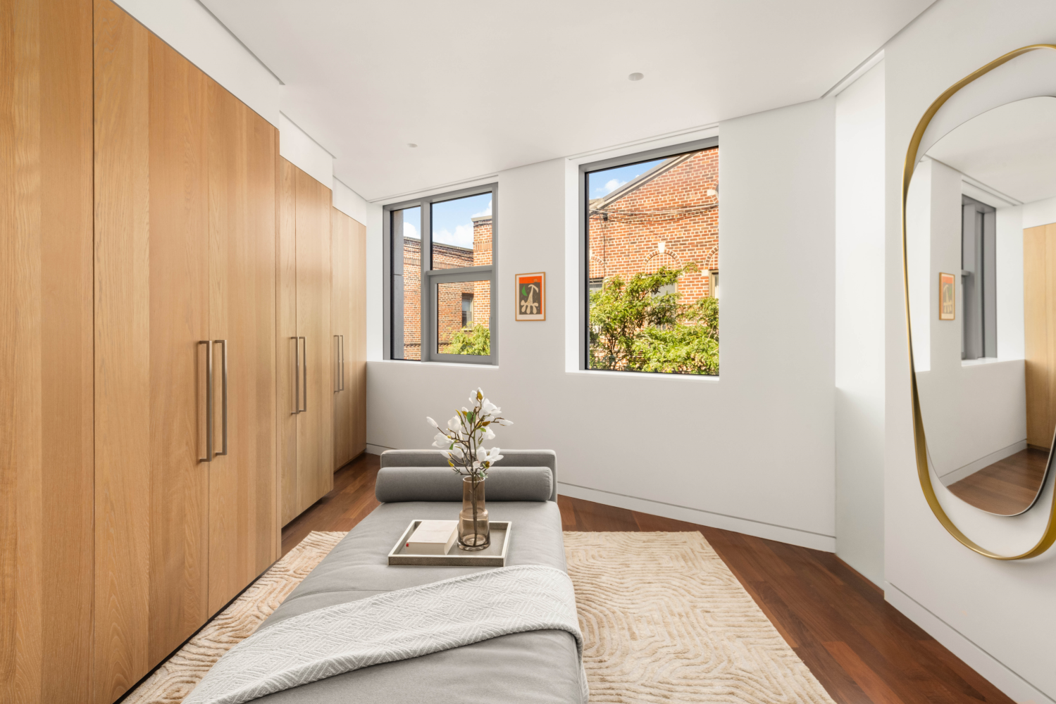 9 Minetta Street Manhattan, NY 10012 - Photo 16 of 18 a bedroom with furniture and a window