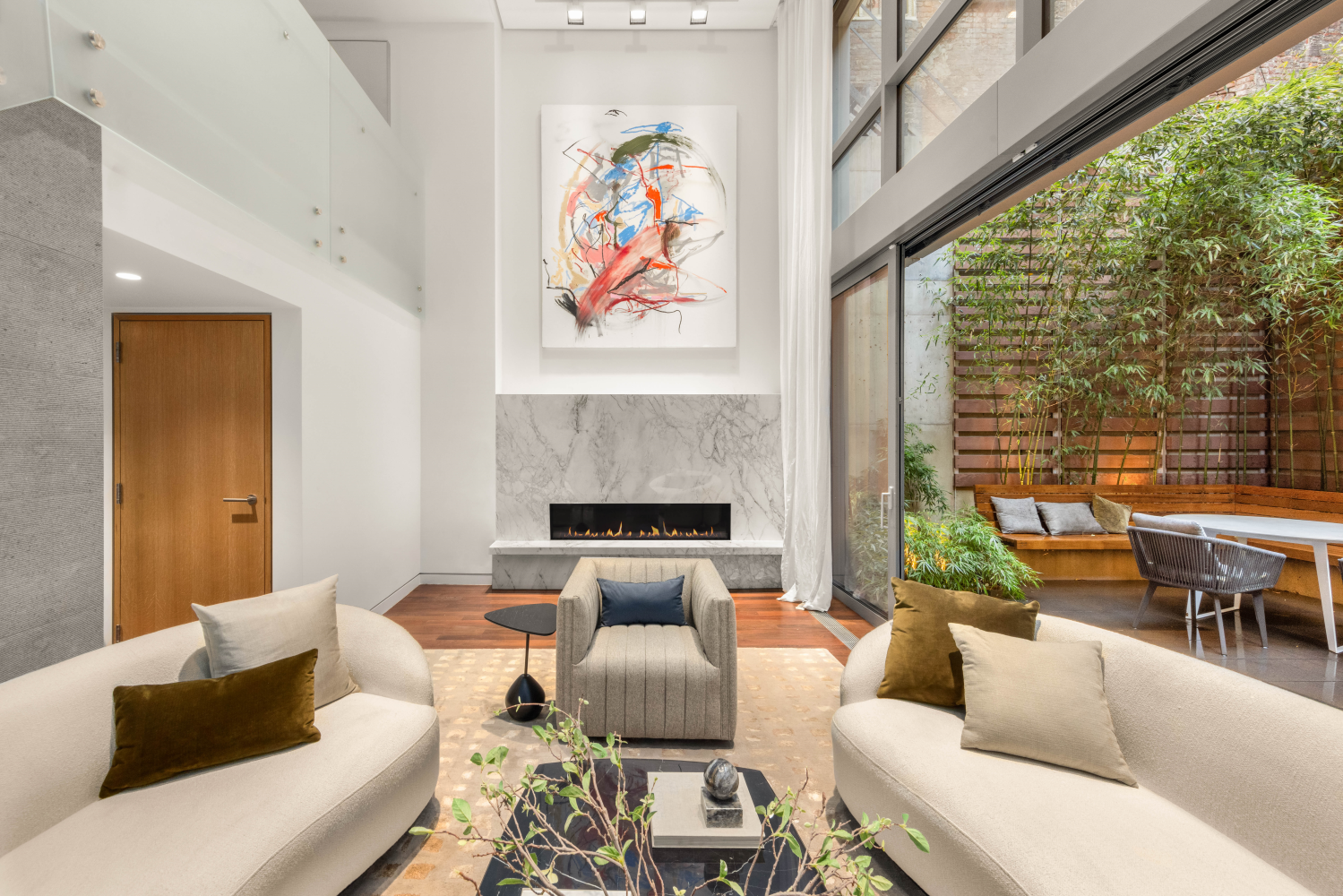 9 Minetta Street Manhattan, NY 10012 - Photo 4 of 18 a living room with furniture and a large window