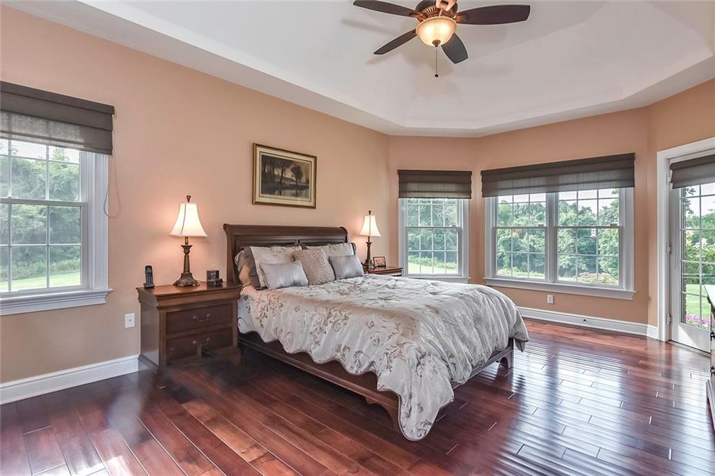 182 Joe Cain Road Bulger, PA 15019 - Photo 15 of 25 First Floor Owner's Suite with Deep Trey Ceiling, Patio Door to your Back patio, Spa-Like Bath with Walk-In-Closet!