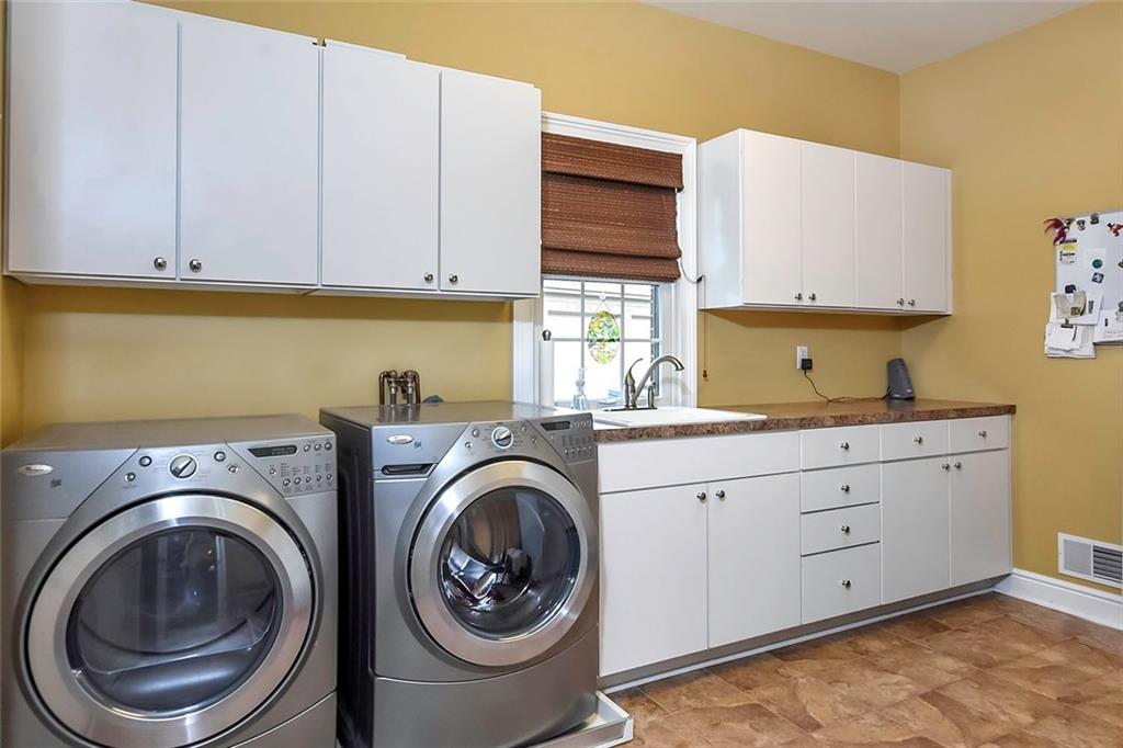 182 Joe Cain Road Bulger, PA 15019 - Photo 23 of 25 1st Floor Laundry/Mud Room with plenty of Cupboards/Cabinetry and a man door to the back patio!