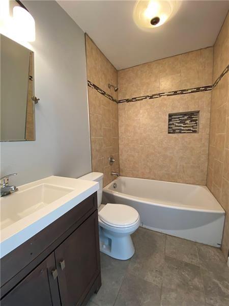 6630 Library Road South Park, PA 15129 - Photo 11 of 21 a bathroom with a sink a toilet and a bathtub