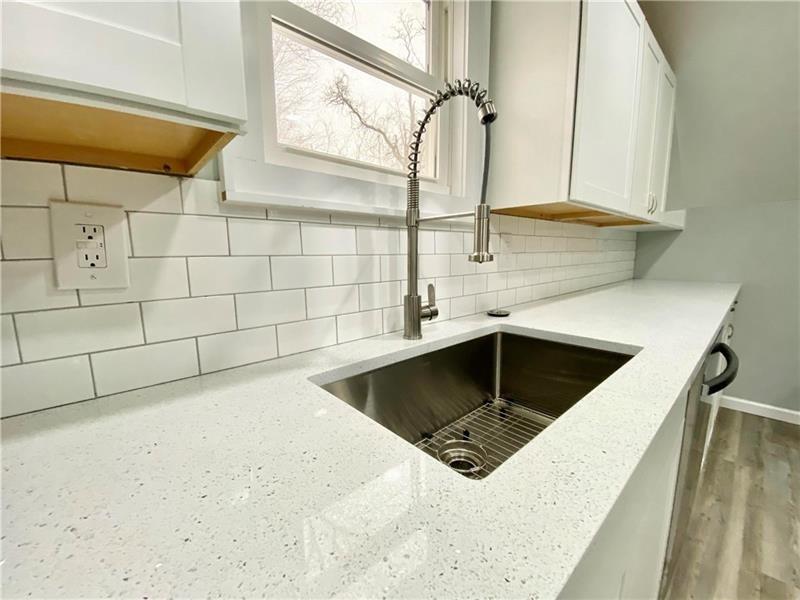 6630 Library Road South Park, PA 15129 - Photo 13 of 21 a kitchen with a sink a counter space and a window