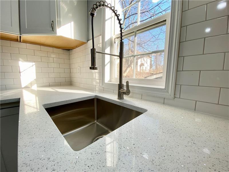 6630 Library Road South Park, PA 15129 - Photo 5 of 21 a view of a kitchen with a sink and cabinets