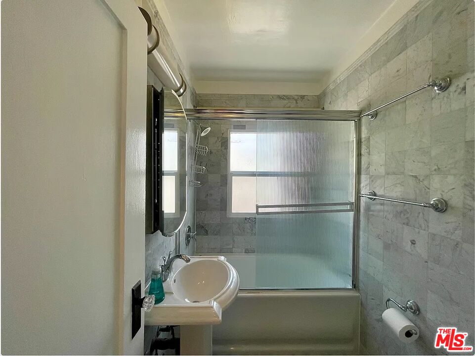 837 5th Street, Unit 839B Santa Monica, CA 90403 - Photo 21 of 23 a bathroom with a sink and a mirror