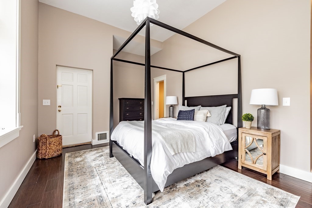 165 Converse Street, Unit 1 Longmeadow, MA 01106 - Photo 11 of 17 a bedroom with a bed table and a dresser