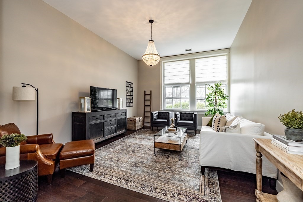 165 Converse Street, Unit 1 Longmeadow, MA 01106 - Photo 2 of 17 a living room with furniture fireplace and a window