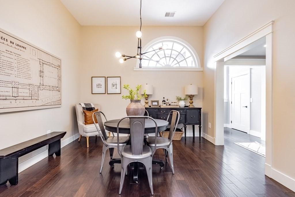165 Converse Street, Unit 1 Longmeadow, MA 01106 - Photo 5 of 17 a view of a dining room with furniture a chandelier and wooden floor