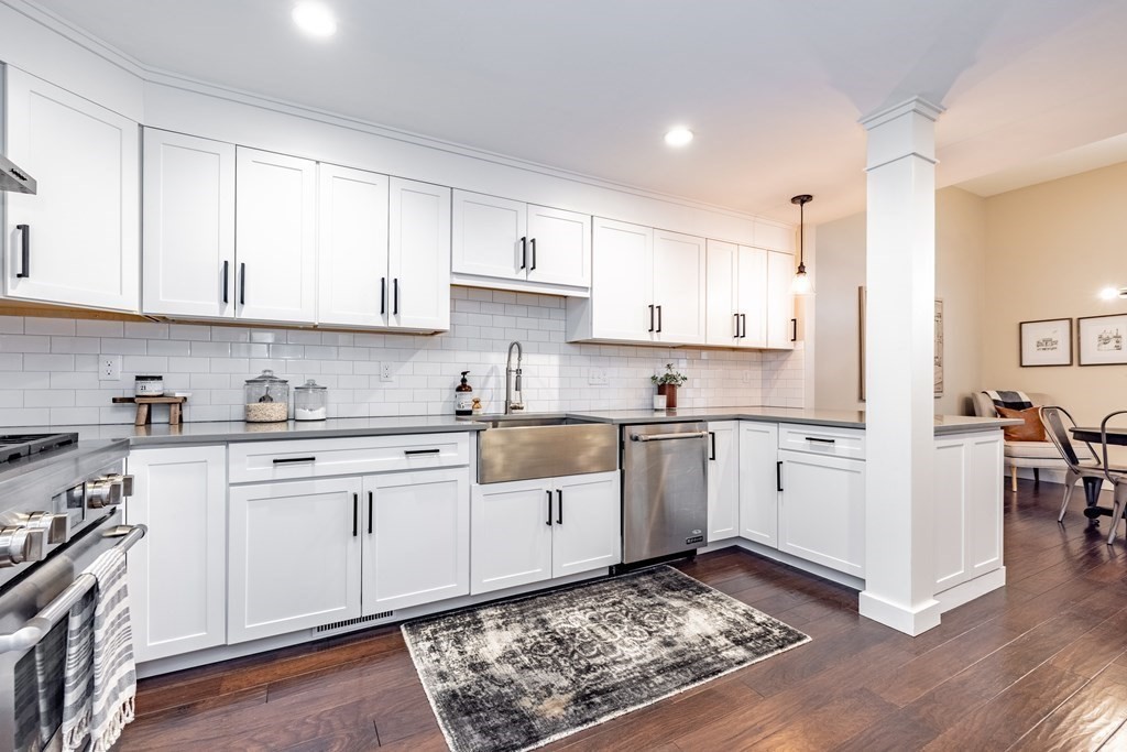 165 Converse Street, Unit 1 Longmeadow, MA 01106 - Photo 6 of 17 a kitchen with granite countertop white cabinets and white appliances