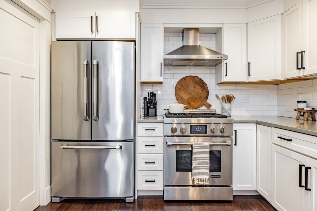 165 Converse Street, Unit 1 Longmeadow, MA 01106 - Photo 10 of 17 a stove top oven sitting inside of a kitchen