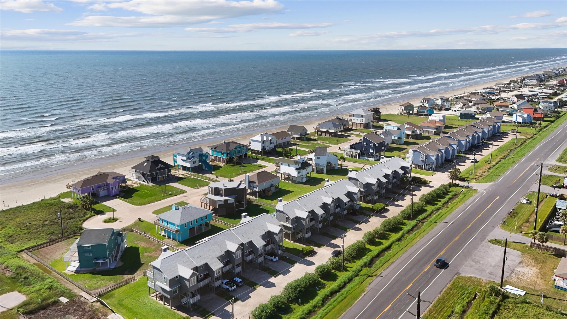 17607 Termini-San Luis Pass Road Galveston, TX 77554 - Photo 41 of 42 The aerial view showcases the beautiful setting of this Karankawa townhome, highlighting its proximity to the expansive coastline. This idyllic location provides the ideal atmosphere for a relaxing retreat, capturing the essence of Galveston’s tranquil West end.