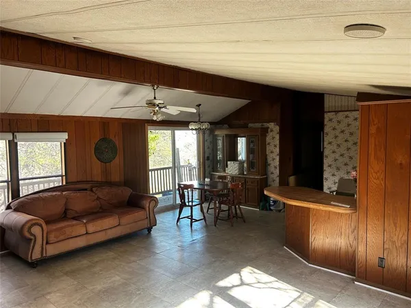 a kitchen with a refrigerator and a sink