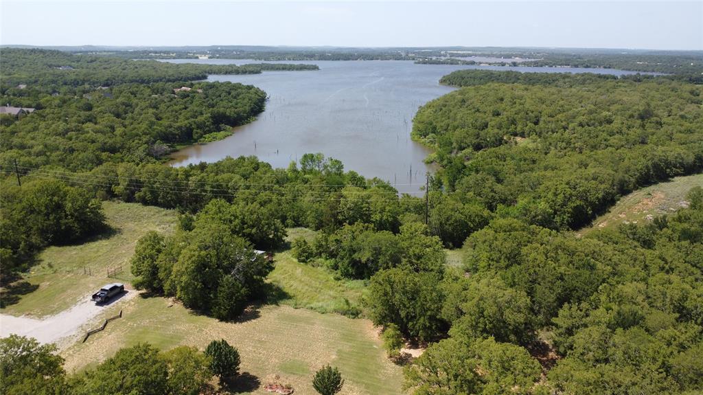 194 Lakeview Court Sunset, TX 76270 - Photo 3 of 19 an aerial view of a houses with a lake view