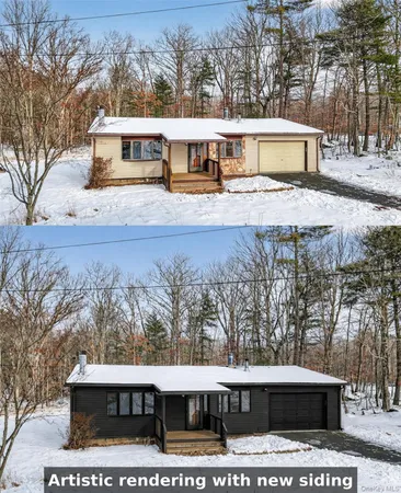 a view of a house with a yard covered in snow