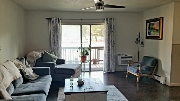 a living room with furniture and a window