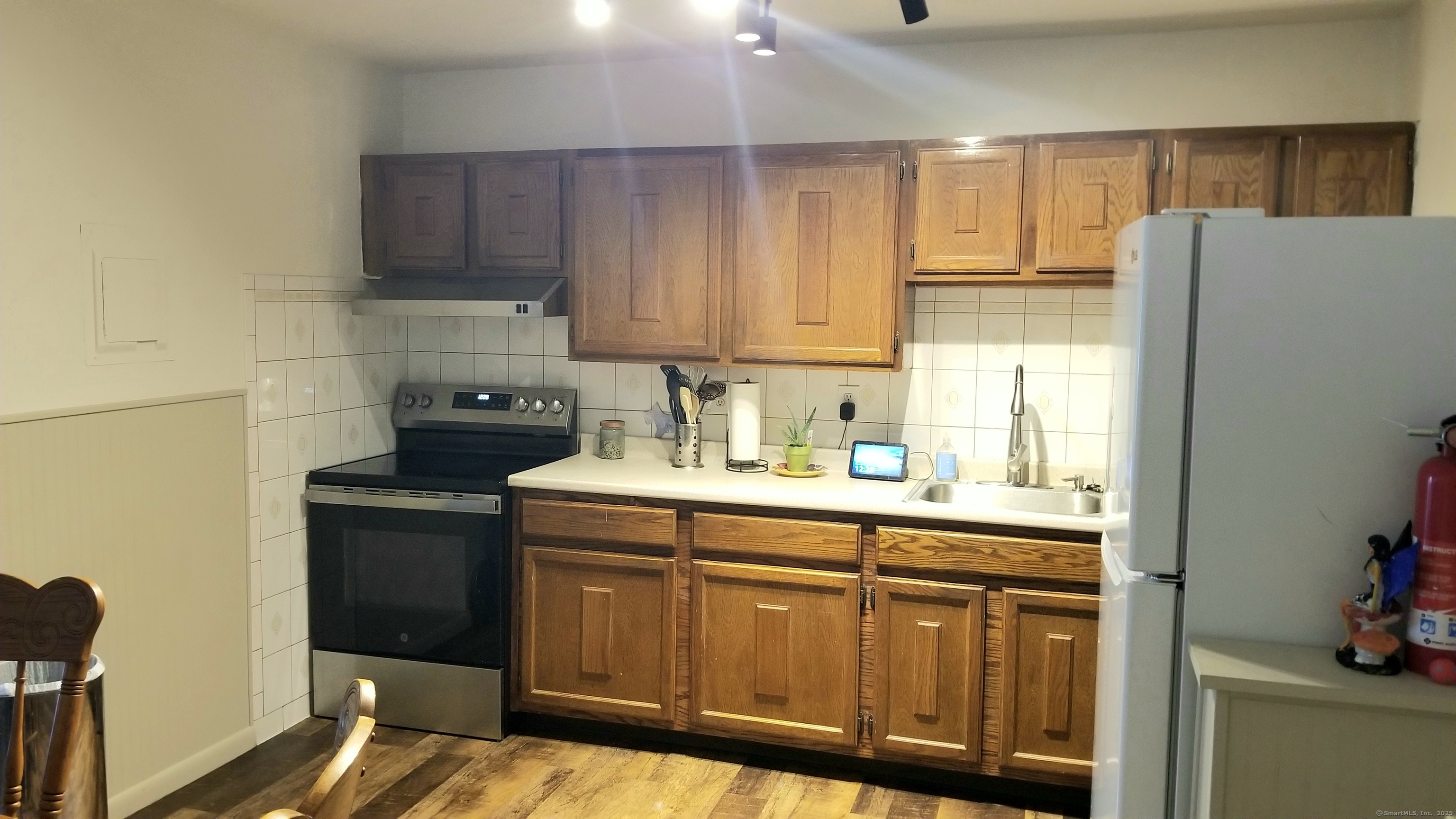75 Balance Rock Road, Unit 11 Seymour, CT 06483 - Photo 7 of 21 a kitchen with a sink a stove and refrigerator