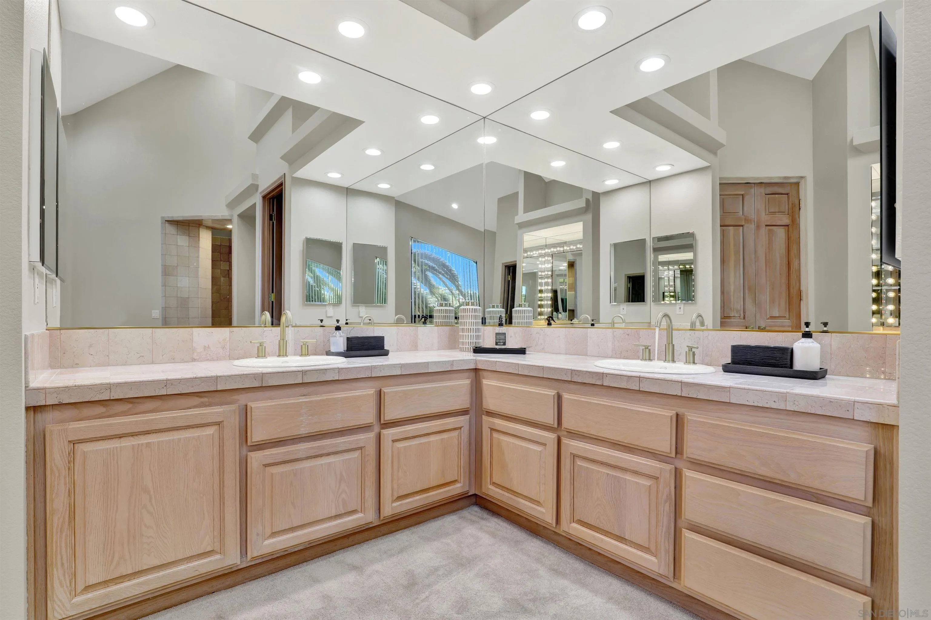 17801 Joyas Court Poway, CA 92064 - Photo 16 of 31 a spacious bathroom with a double vanity sink and mirror