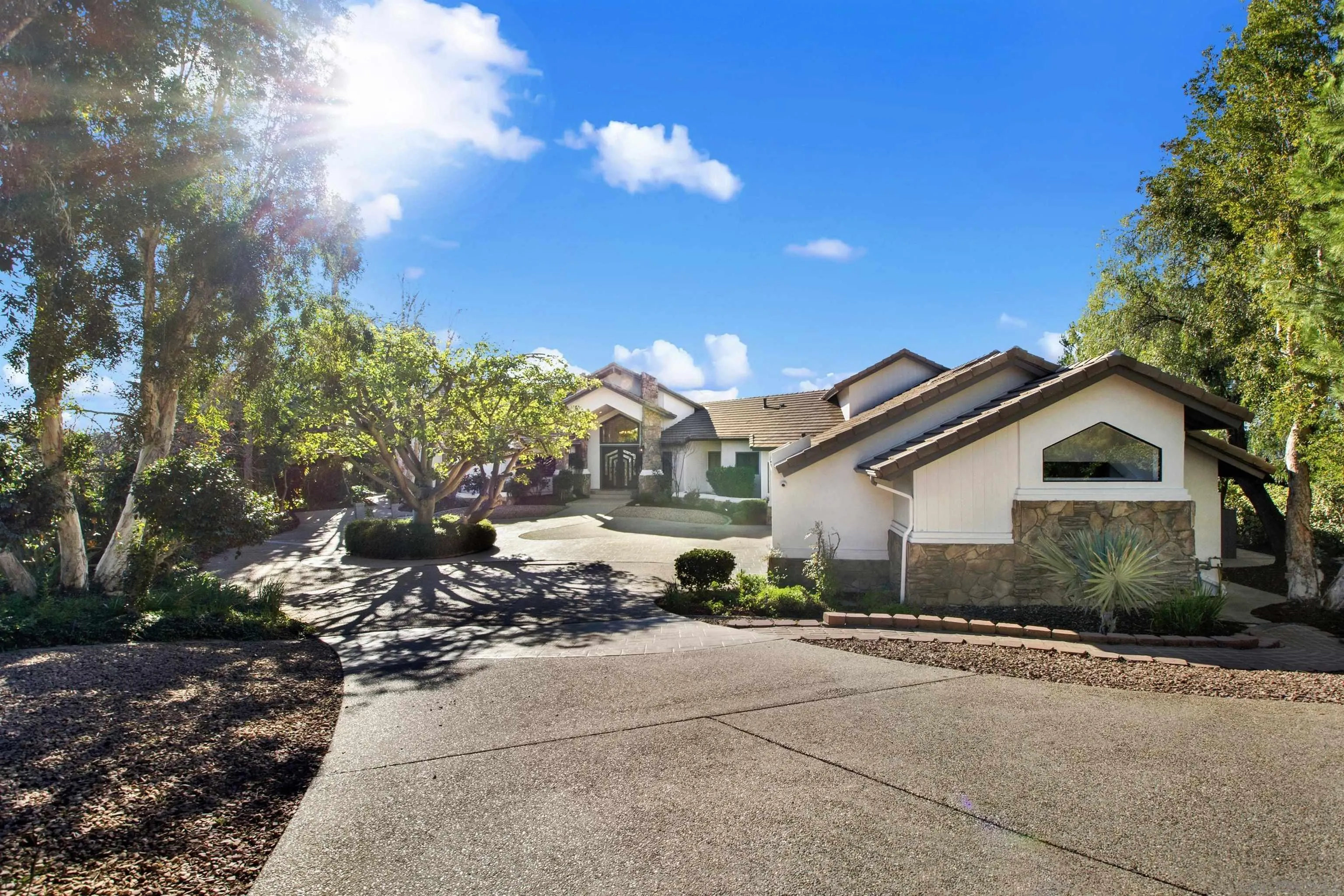 17801 Joyas Court Poway, CA 92064 - Photo 2 of 31 a front view of a house with a yard and tree s