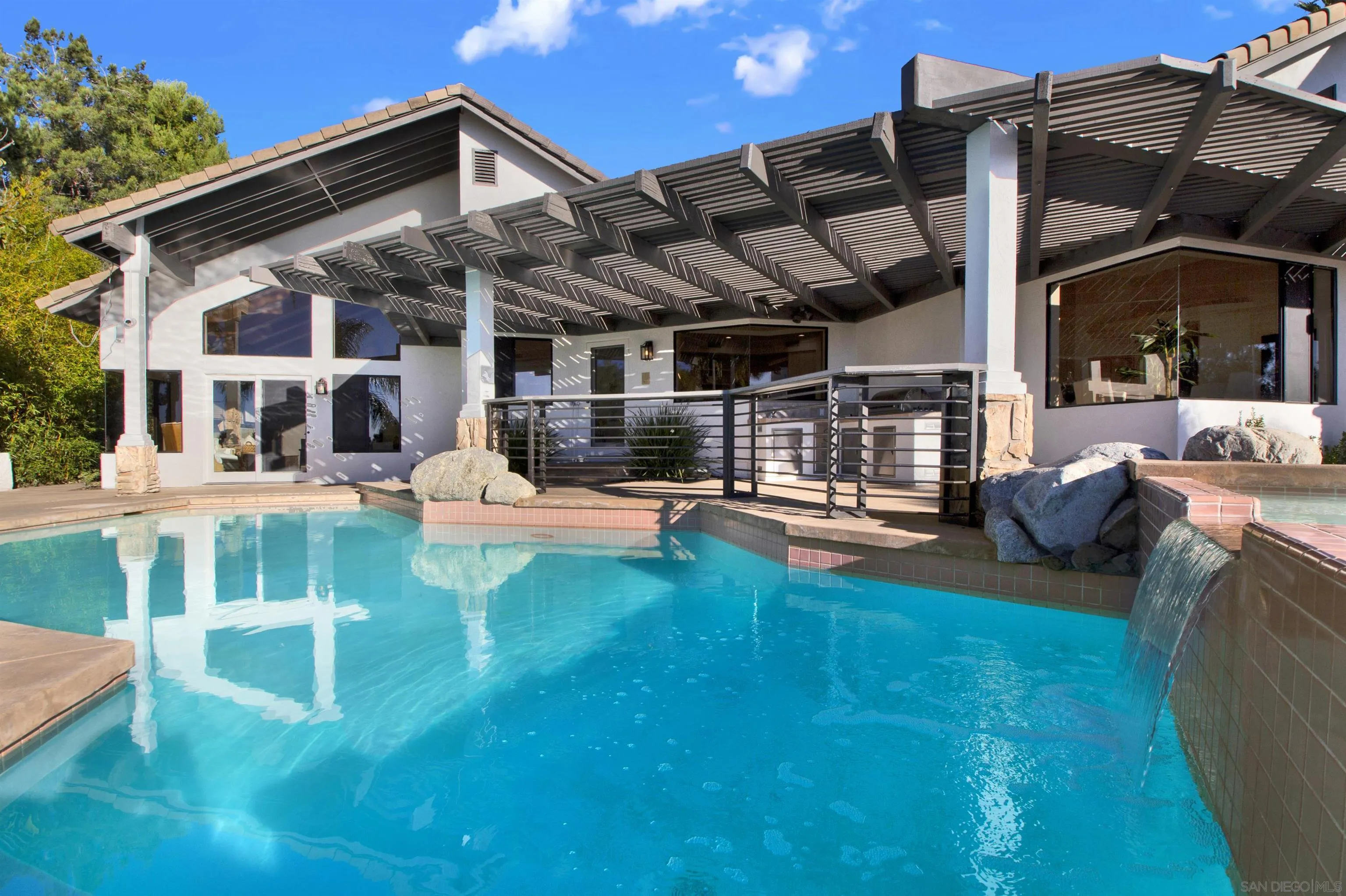 17801 Joyas Court Poway, CA 92064 - Photo 27 of 31 a view of a house with backyard porch and sitting area
