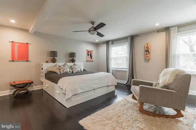 a bedroom with a bed furniture and a window