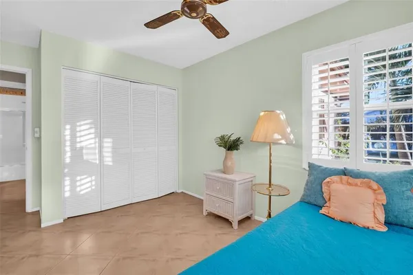 a bedroom with furniture and a window