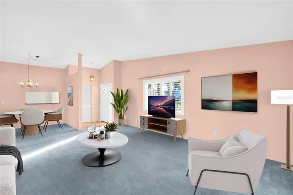 a living room with furniture and a table