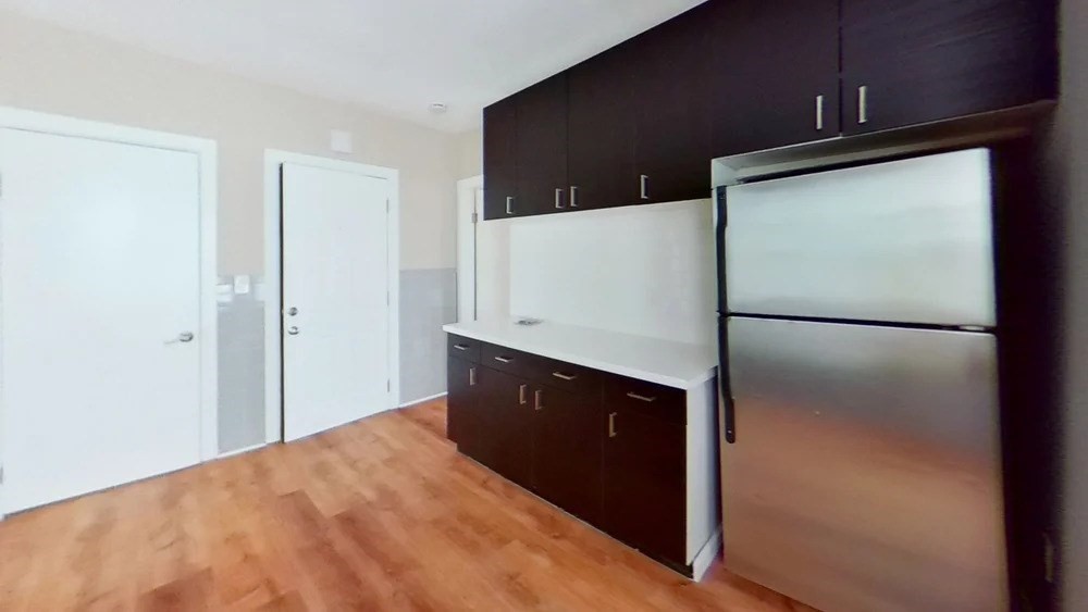 121 George Street, Unit 2 Boston, MA 02119 - Photo 3 of 8 a kitchen with a refrigerator and a sink