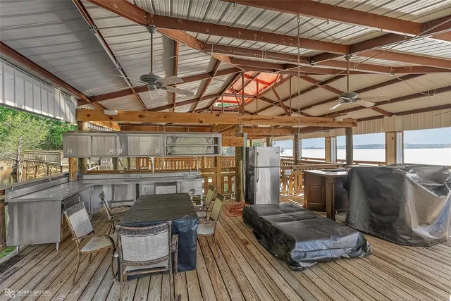 a view of a chairs in wooden deck