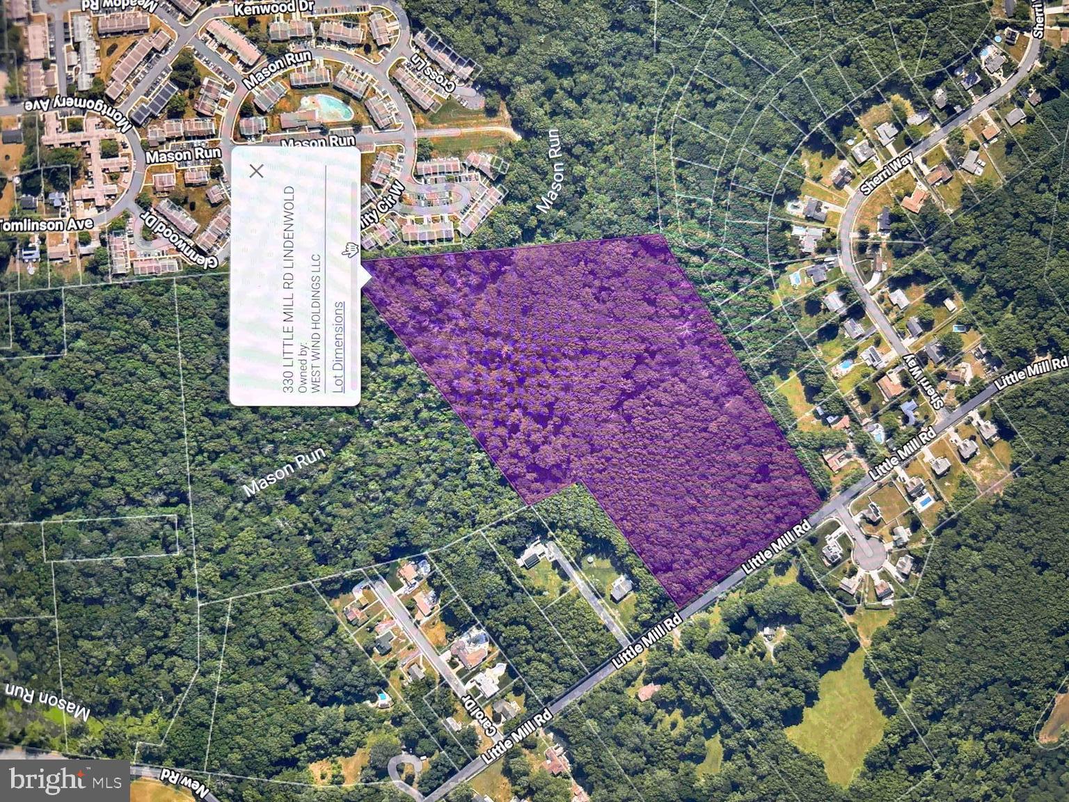 a aerial view of a house with a yard and garden