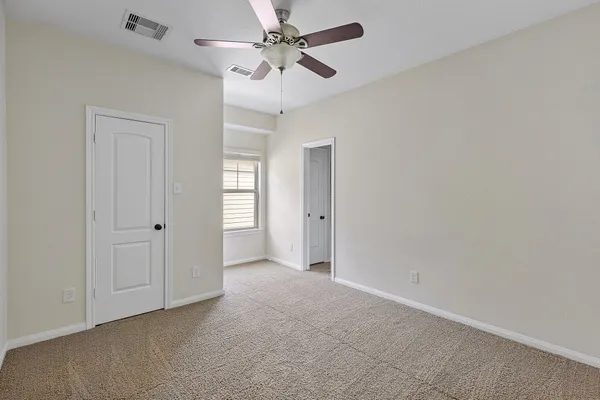 an empty room with a bathroom