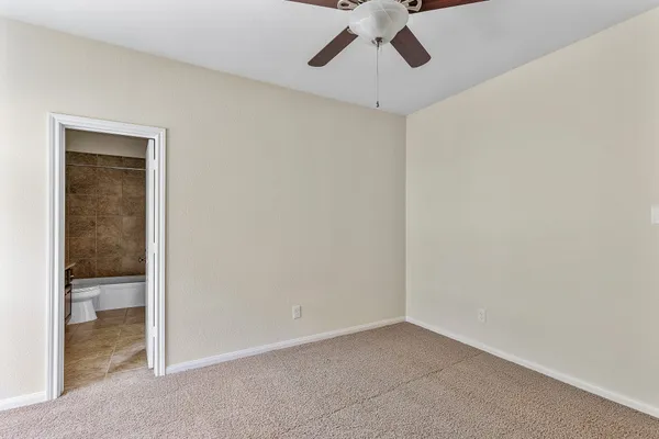 a bathroom with a granite countertop bathtub shower sink and mirror