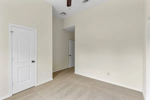 a view of walk in closet with clothes