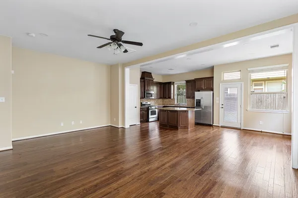 a view of kitchen with granite countertop cabinets and stainless steel appliances