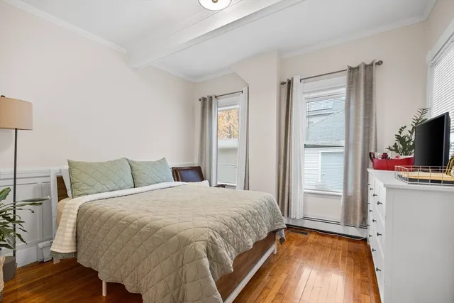 a bed room with a bed and a television