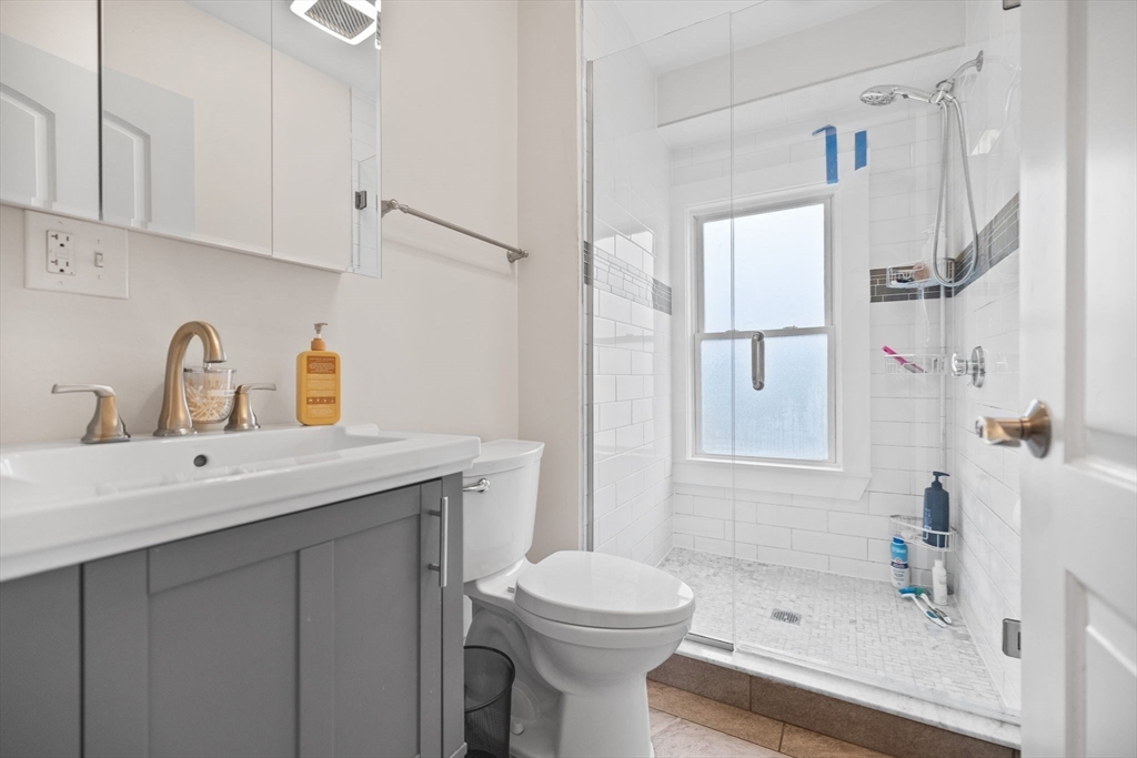 33 Clinton Street Framingham, MA 01702 - Photo 14 of 26 a bathroom with a sink toilet and shower