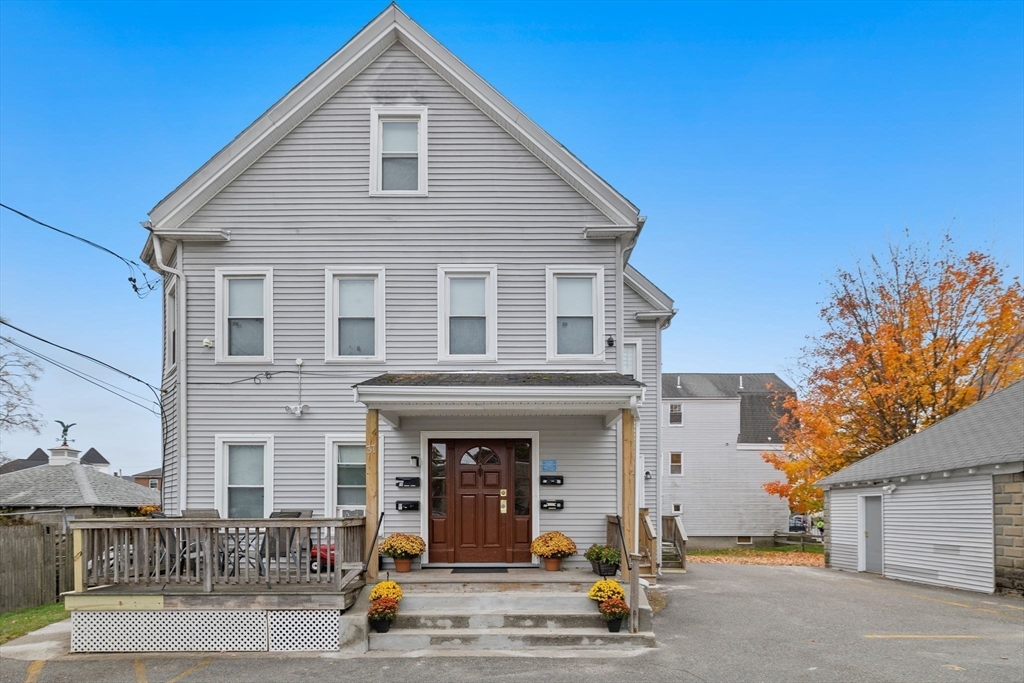 33 Clinton Street Framingham, MA 01702 - Photo 20 of 26 a view of a brick house with many windows