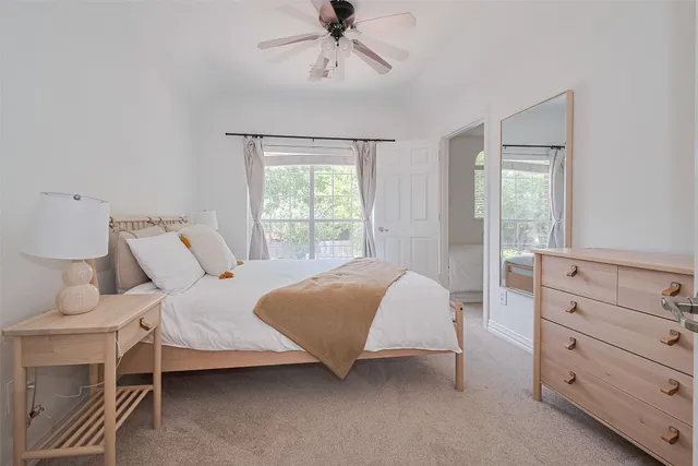 a view of a house with swimming pool and sitting area