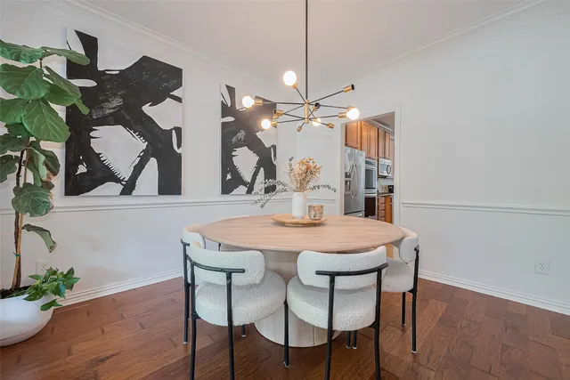 a living room with furniture a fireplace and a large window