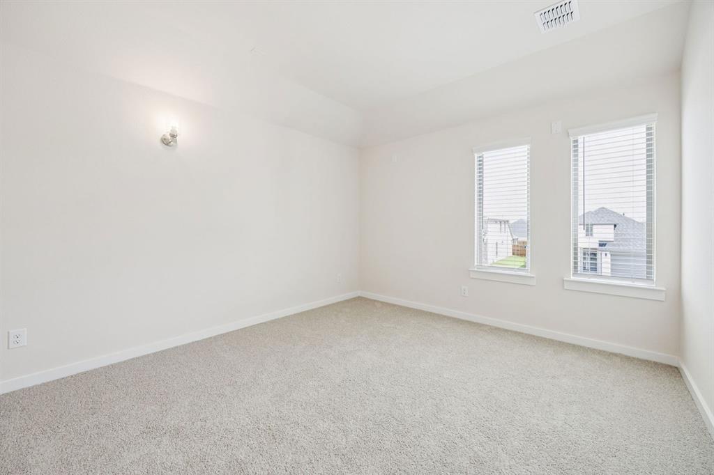 483 Sierra Ridge Lavon, TX 75166 - Photo 23 of 29 an empty room with windows