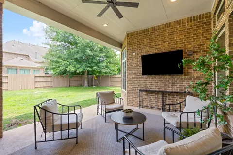 a view of an chairs and table in the patio