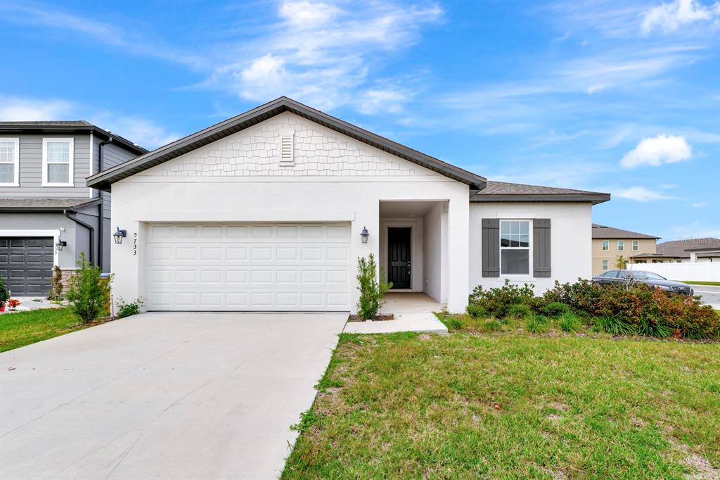 5733 Iron Brand Road St. Cloud, FL 34771 - Photo 1 of 1 a front view of house with yard and green space