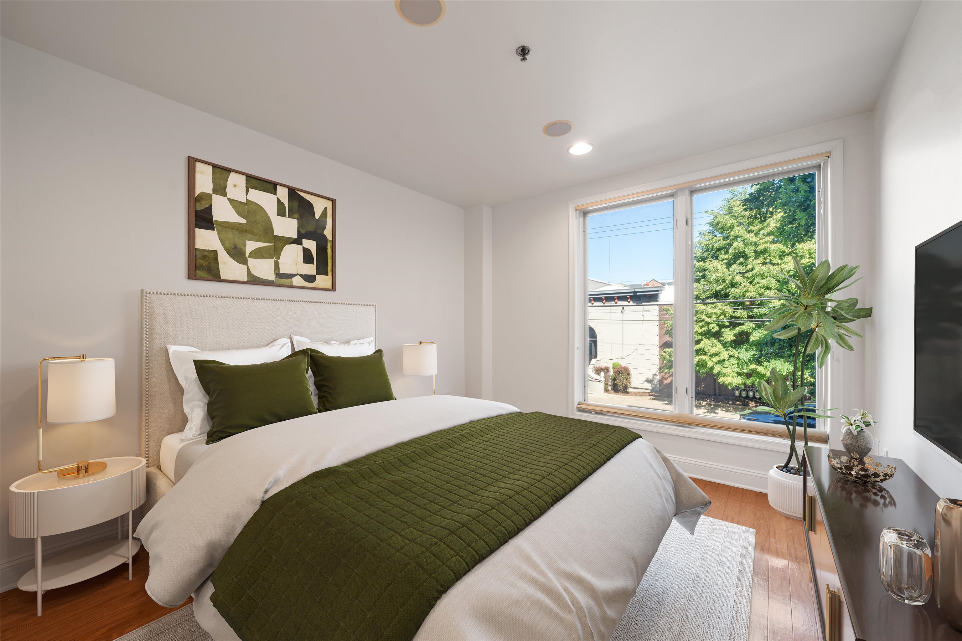 70 Adams Street, Unit 2F Hoboken, NJ 07030 - Photo 5 of 20 a bedroom with a bed and a large window