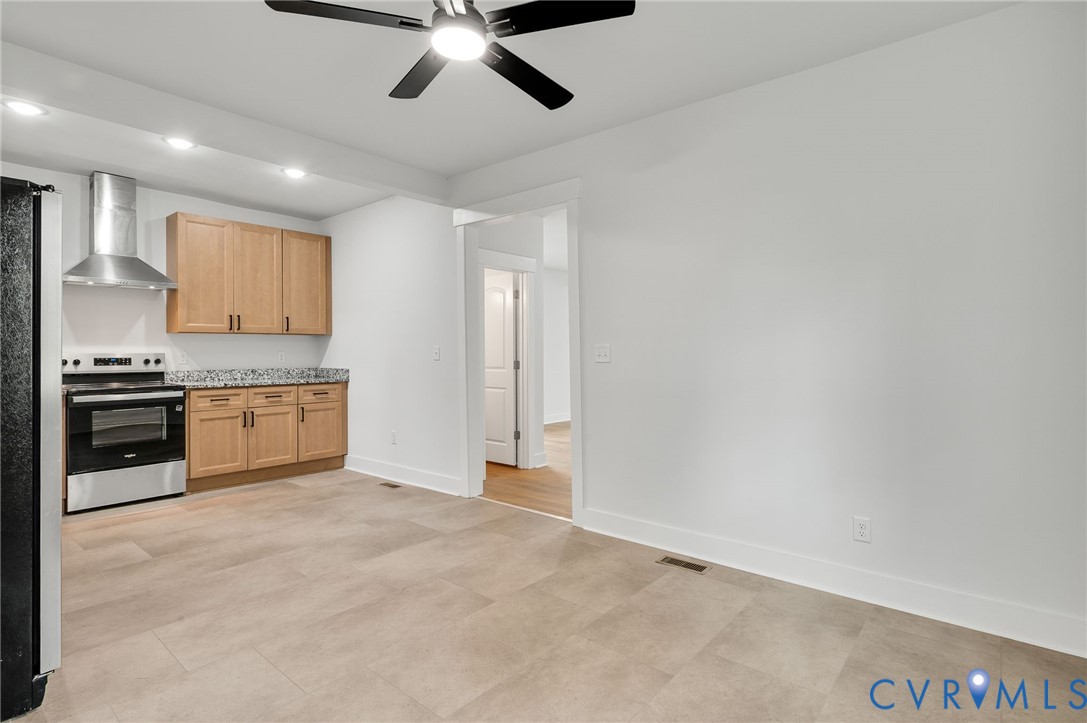 1619 12th Street Victoria, VA 23974 - Photo 15 of 30 a view of a kitchen with a sink cabinets and a ceiling fan