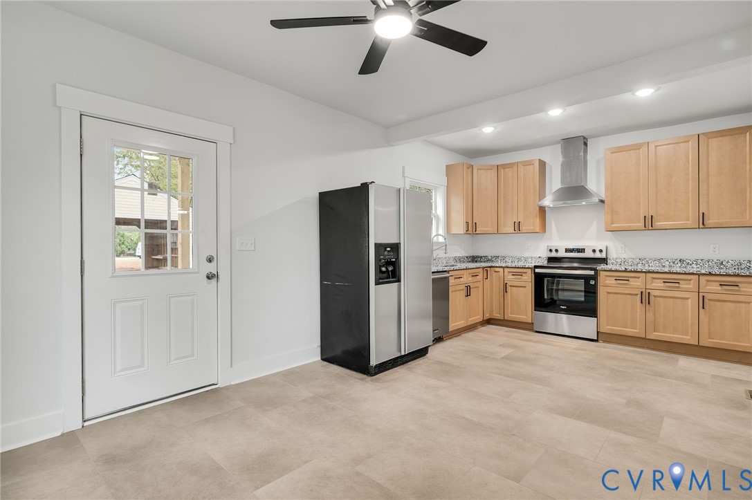 1619 12th Street Victoria, VA 23974 - Photo 16 of 30 a kitchen with granite countertop stainless steel appliances cabinets a sink and a window