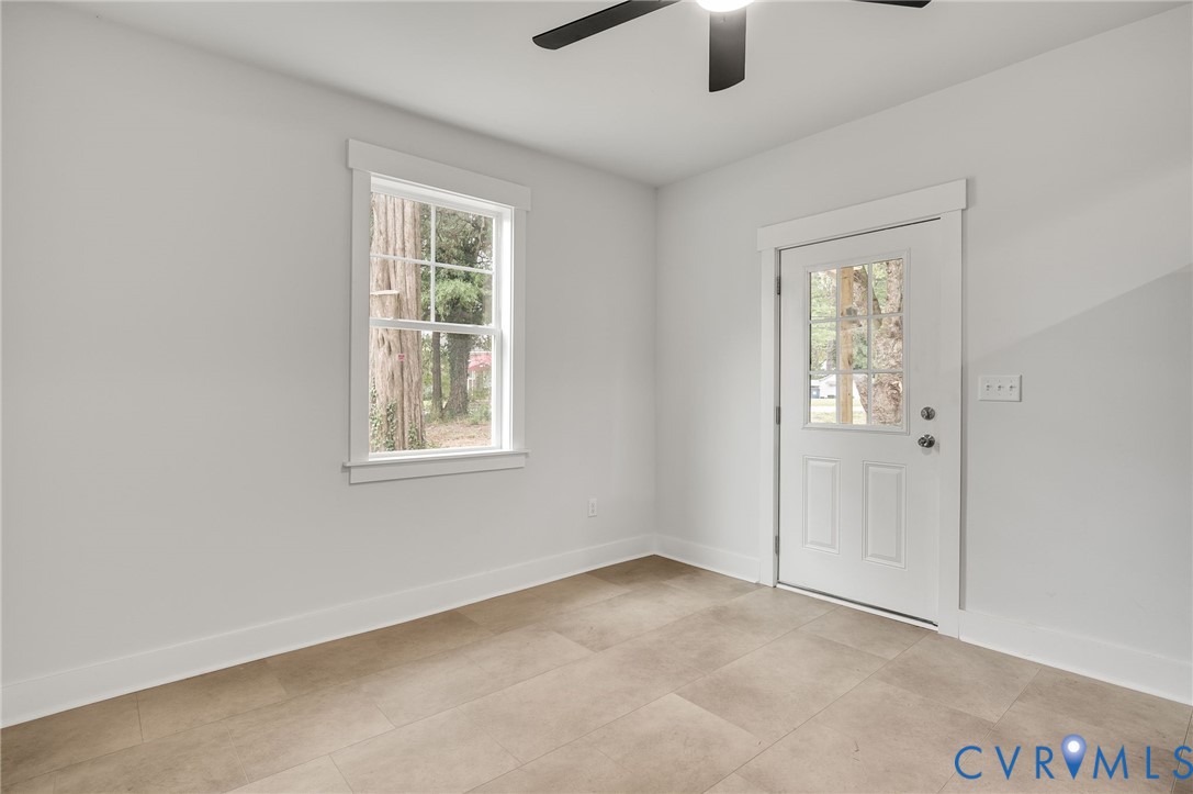 1619 12th Street Victoria, VA 23974 - Photo 17 of 30 an empty room with windows and fan