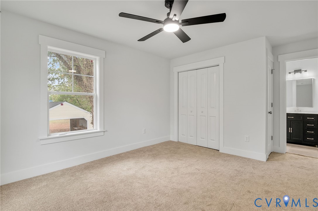 1619 12th Street Victoria, VA 23974 - Photo 19 of 30 an empty room with a window and a fan