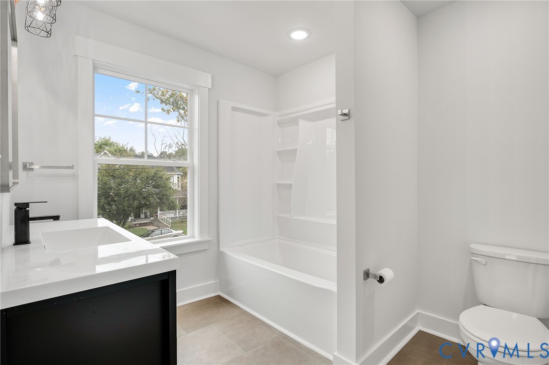 1619 12th Street Victoria, VA 23974 - Photo 28 of 30 a bathroom with a sink a toilet and shower