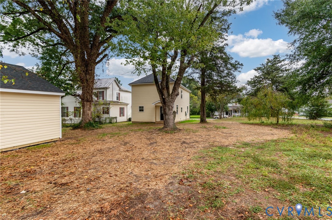 1619 12th Street Victoria, VA 23974 - Photo 6 of 30 a house with trees in front of it