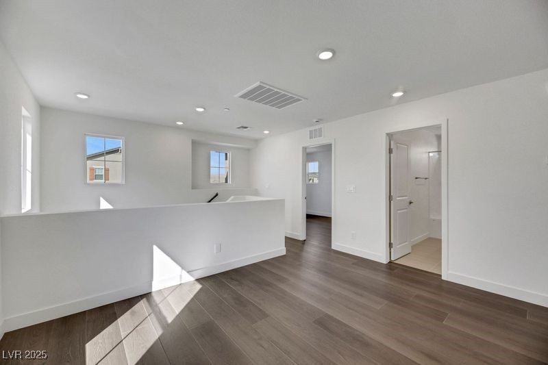 2770 Alfena Place Henderson, NV 89044 - Photo 19 of 26 Unfurnished room with dark wood-type flooring and recessed lighting