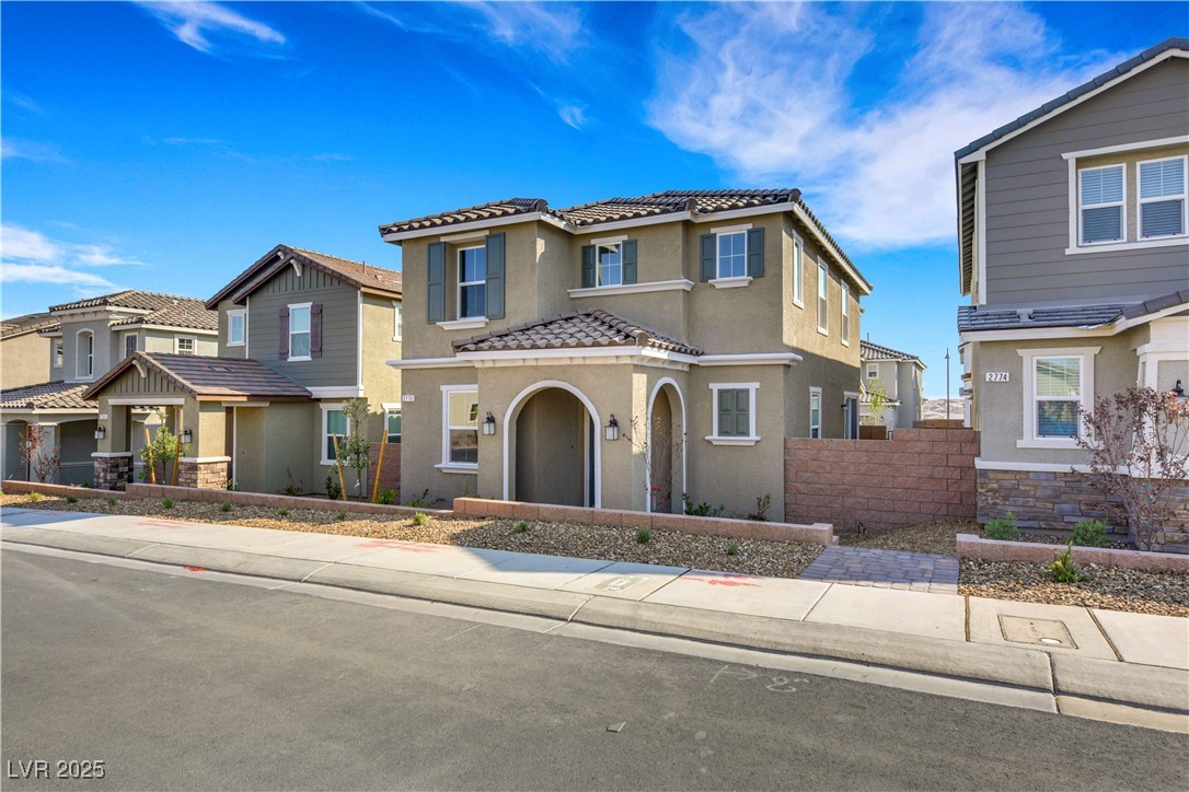 2770 Alfena Place Henderson, NV 89044 - Photo 25 of 26 View of front facade with stucco siding, a tile roof, and a residential view