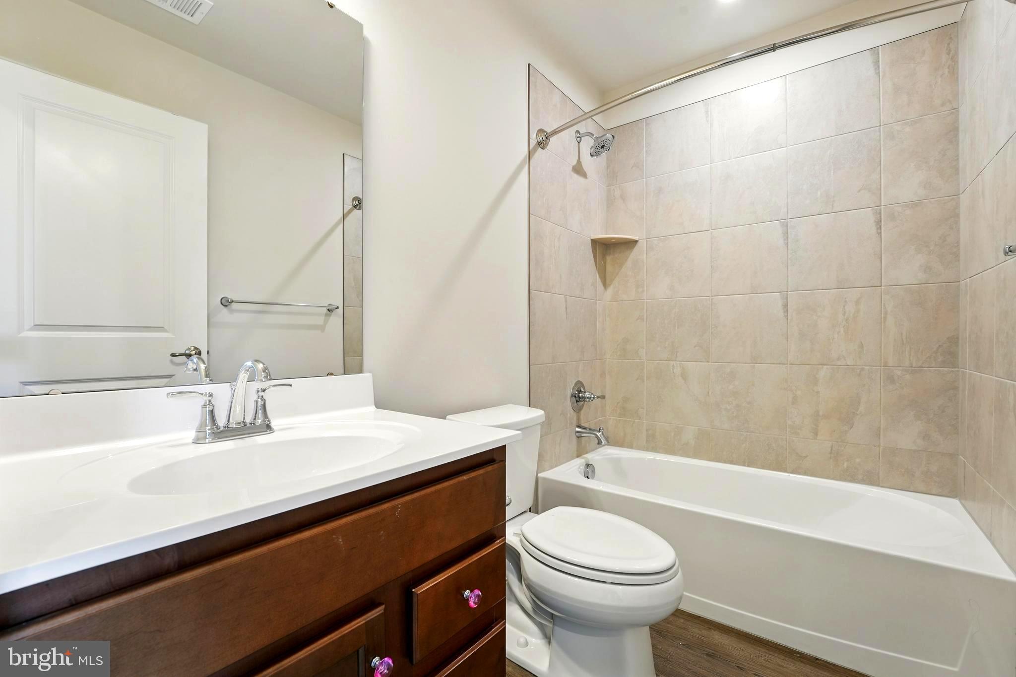 1754 Scenic Loop Culpeper, VA 22701 - Photo 18 of 39 a bathroom with a sink a toilet and a bathtub